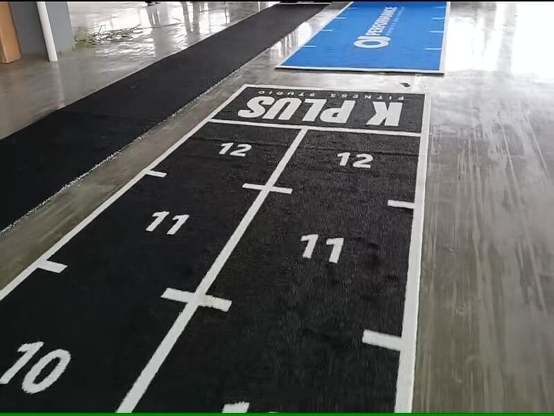 Layout plan of a gym showing clear safety aprons and color-coded agility lanes